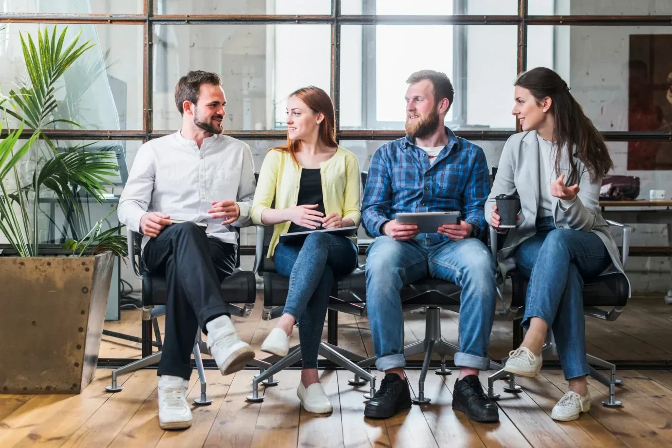 young-company-colleagues-sitting